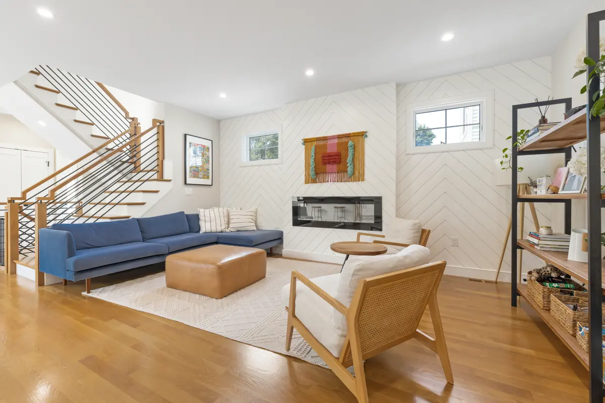 Linear gas fireplace set into a chevron shiplap wall