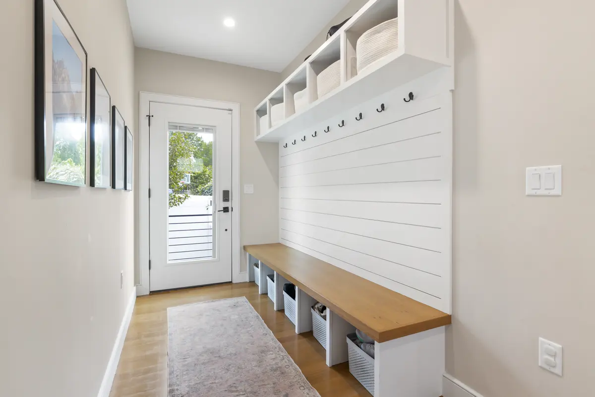 Built-in bench, cubbies and hooks off the side entry