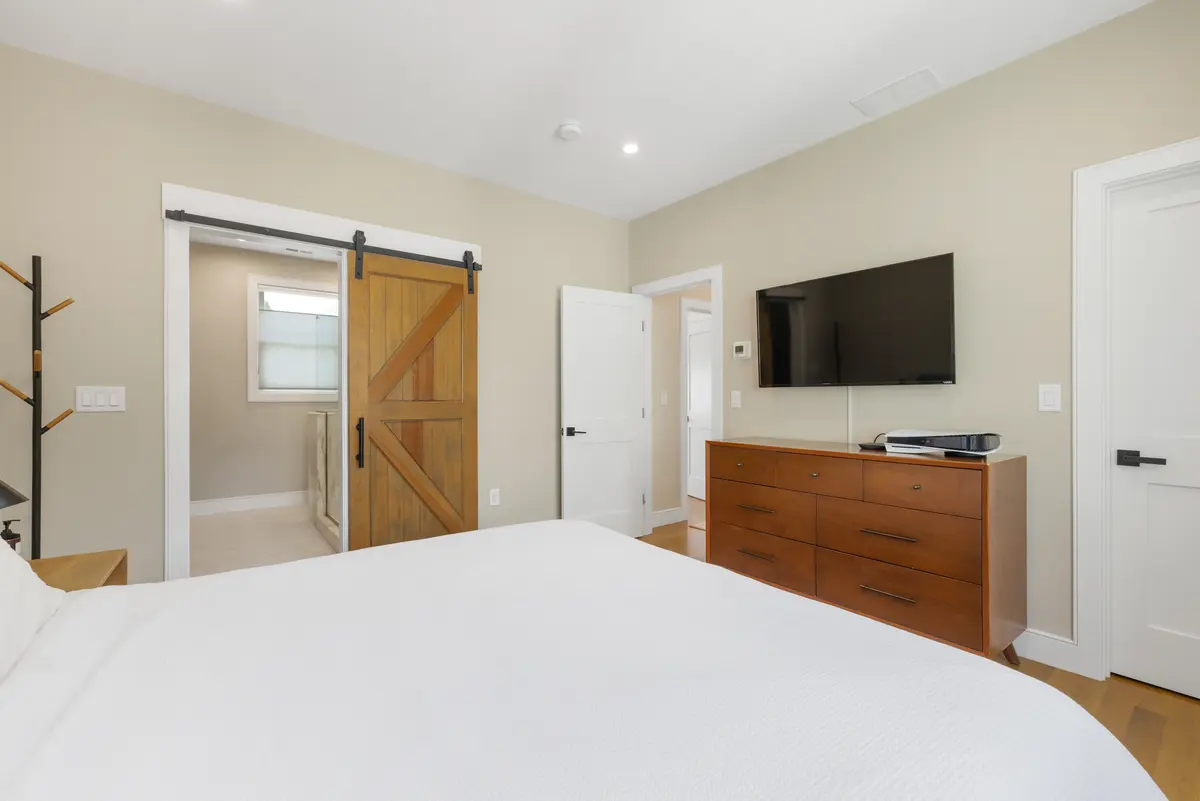 The primary bedroom, looking back toward the hall
