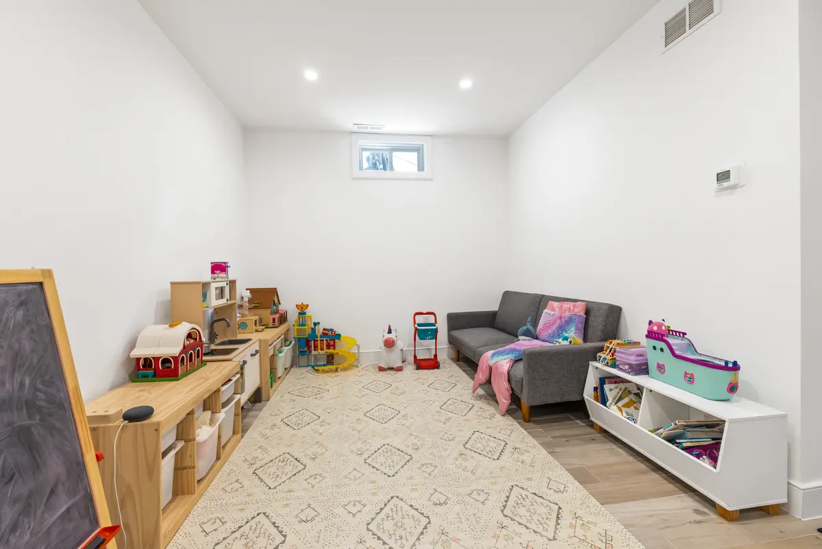 The far end of the family room, set up as a play area